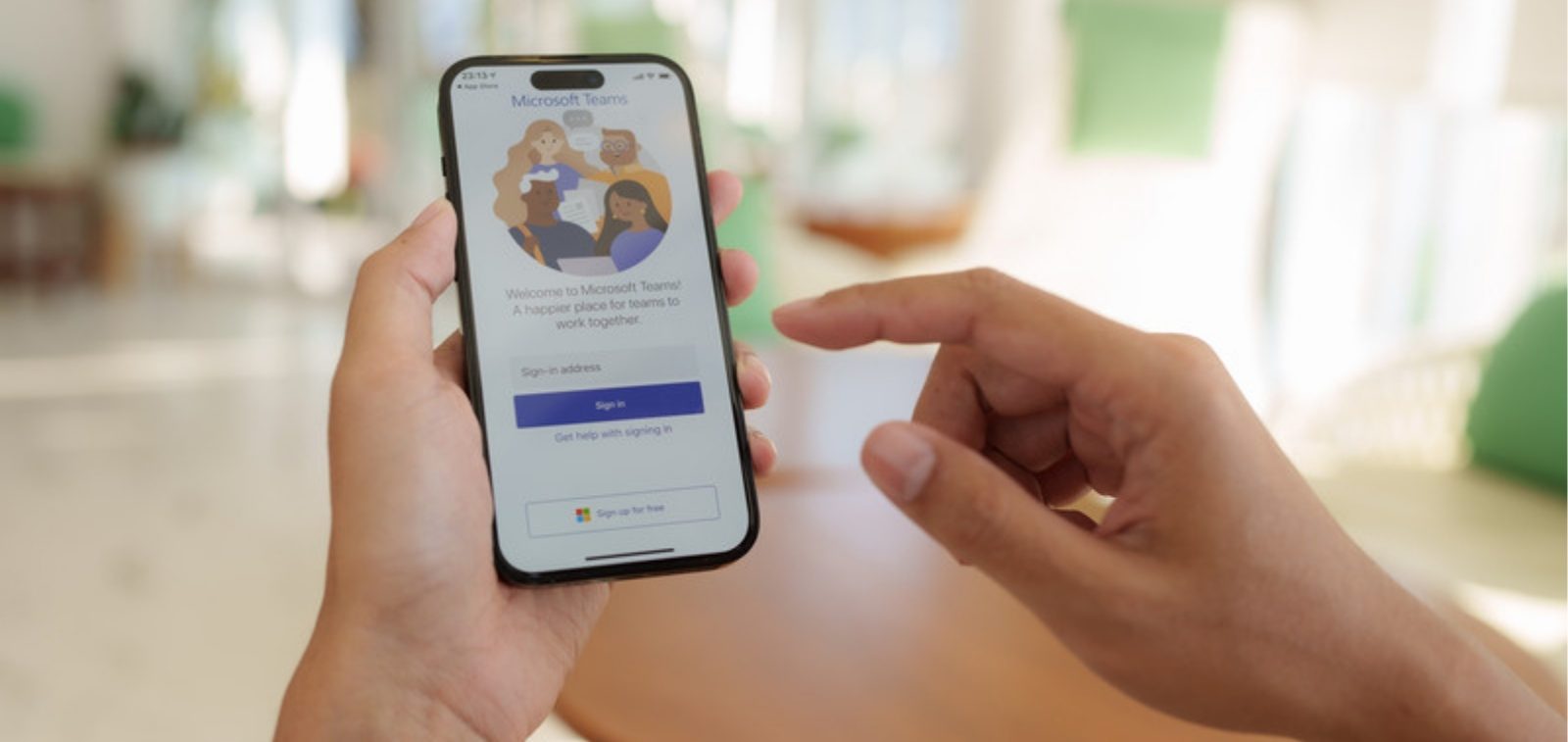 Person signing in to Microsoft on a smartphone - Microsoft is retiring SMS and Voice MFA